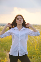 Young brunette with green eyes looking at viewer