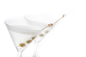 Classic Dry Martini with olives isolated on white background. Copyspace