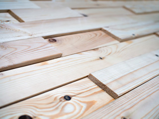 Decorative panels assembled from the boards of natural wood