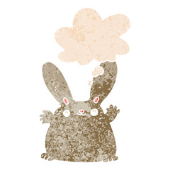 cartoon rabbit and thought bubble in retro textured style