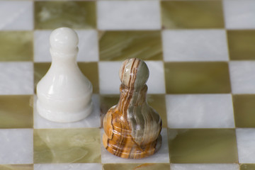 Chess pawns on the board. Dedicated to International Chess Day.