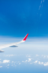 Fototapeta premium aircraft Wing on cloudscape and blue sky
