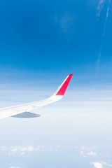 aircraft Wing on cloudscape and blue sky