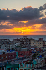 Fototapeta na wymiar Aerial view of the residential neighborhood in the Havana City, Capital of Cuba, during a colorful sunset.