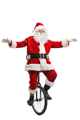 Santa claus balancing with hands and riding a unicycle © Ljupco Smokovski