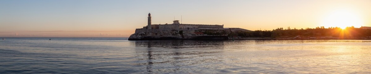 Panoramic view of the Lighthouse in the Old Havana City, Capital of Cuba, during a colorful and sunny sunrise.