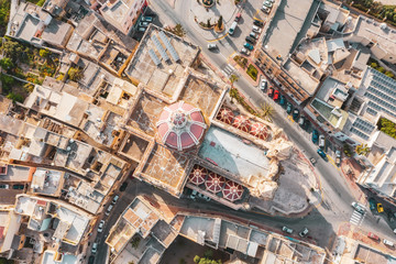 Zabbar Parish Church on the island of Malta, aerial view above, around typical houses buildings.