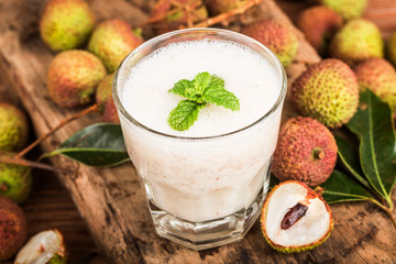 Fresh made Lychee Juice on wooden background