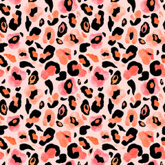 Leopard or cheetah skin seamless pattern with pink, black, beige and orange spots of watercolor paint. Hand painted repeat background. Exotic animal print.