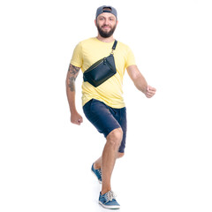 Man in shorts and cap walking goes running happiness smiling on white background isolation