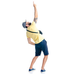 Man in shorts and cap standing looking hands up showing pointing on white background isolation, back view
