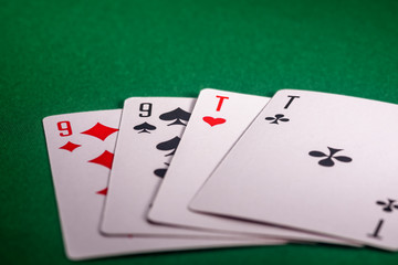 playing cards on the green table. Combination 