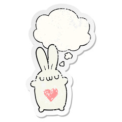 cute cartoon rabbit with love heart and thought bubble as a distressed worn sticker