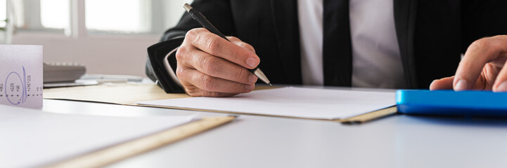 Businessman working on financial paperwork