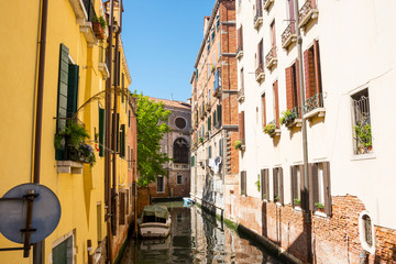 Fototapeta na wymiar View of the canal, old houses and bridge in Venice, Italy