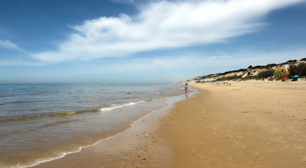 Unknown people at the beach of Asperillo and Pico del Loro in Mazagon, very close to the famous Doñana National Park in the province of Huelva, Andalusia, Spain