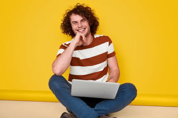 Cheerful coder smiling for camera