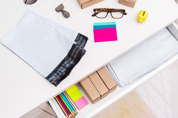 Office desk with post envelopes, top view