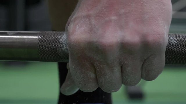 Close Up Man Grips Weight Bar