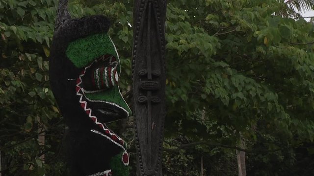 LOCKED OFF side view of Traditional tam tam wooden carving in Vanuatu