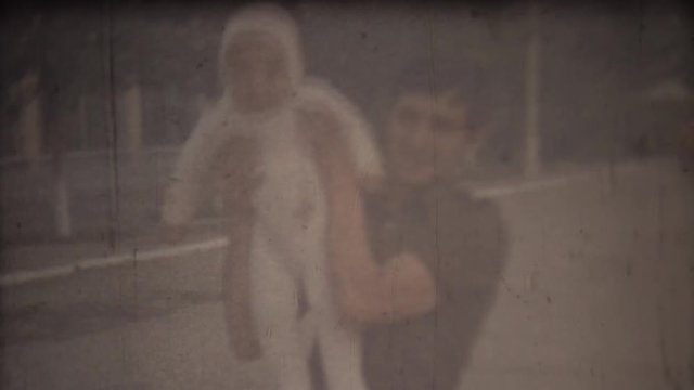 Family chronicle: Happy father shows his newborn son and feel pride. Screenshot 8 mm retro cinema camera