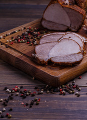 veal roll on wooden board