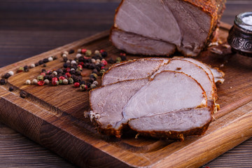 veal roll on wooden board