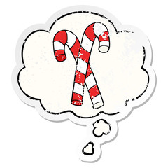 cartoon candy canes and thought bubble as a distressed worn sticker