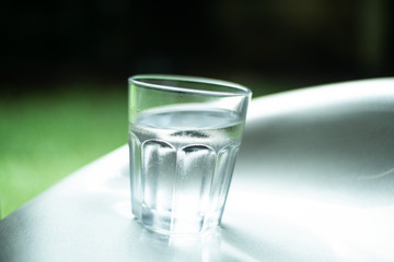 a glass of cold water with drops of water