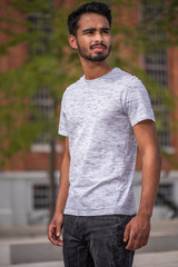 Male model posing in front of old industrial river