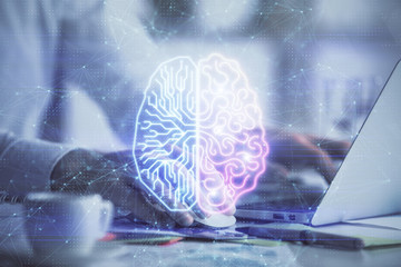 Man typing on keyboard background with brain hologram. Concept of big Data.