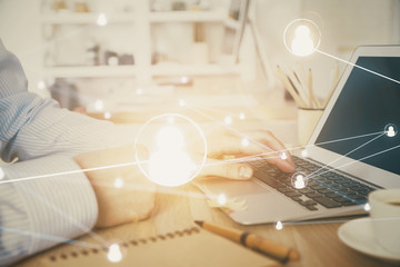 Social network theme hologram with businessman working on computer on background. Concept of world wide web. Multi exposure.