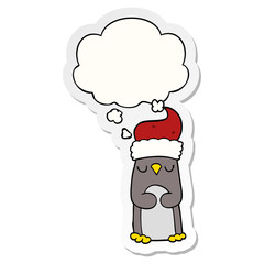 cartoon christmas penguin and thought bubble as a printed sticker