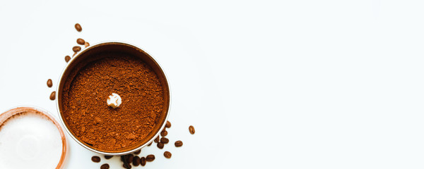 Coffee grinder with coffee beans isolated on white background