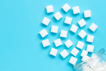 Cubes of sugar on a blue background.