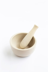 Mortar and pestle on white.