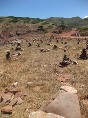Stones stacked as a luck symbol in Menorca beach