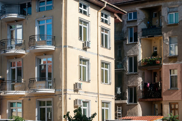 Fototapeta premium Urban renovated and neglected buildings closeup in sunny day