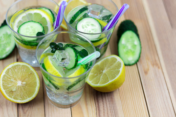 refreshing drink with ingredients, cucumber water in three glass