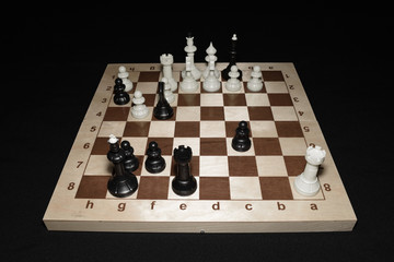 Chess board under black pawns as a leisure backdrop