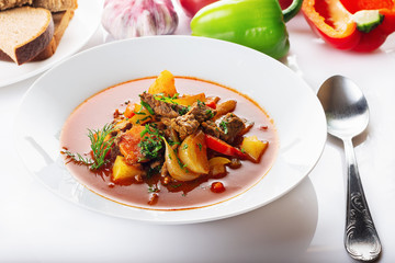 Hot beef hungarian  goulash soup with paprika, beef, potatoes, carrots, onion, pepper and herbs....