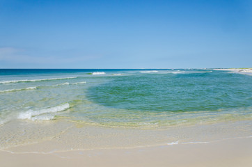 Tropical ocean beach landscape scene. Beautiful scenic tourist travel destination location. Relaxing Gulf Coast seaside beaches.