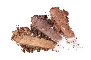 .Shiny smear of beige and brown eyeshadow