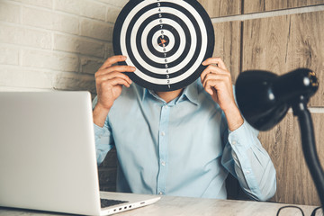 man hand target in face