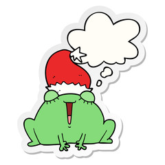 cute cartoon christmas frog and thought bubble as a printed sticker