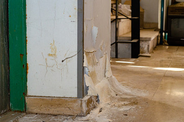 abandoned basement crack mold wall, dusty corner spider web