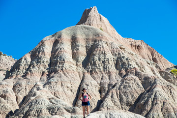 Fototapeta premium Woman Conquering a Mountain