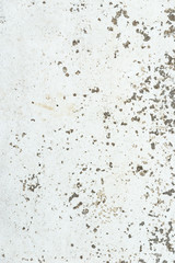 Texture of peeling and cracking white paint on concrete wall