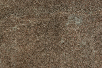 The texture of the concrete wall of very small stones and a lot of irregularities