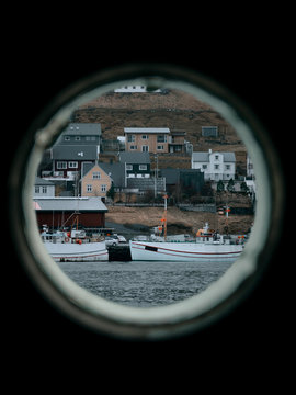 View of a port in Faroe Islands from boat window 